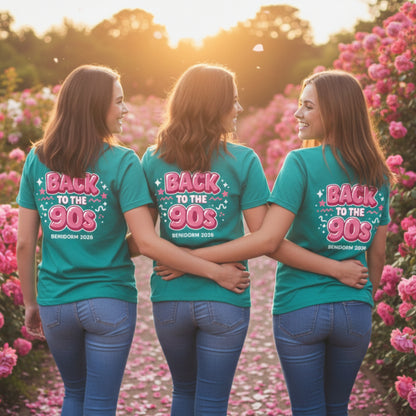 Three Hen party girls  wearing teal t-shirts with 'Back to the 90s' text in a field of pink flowers.