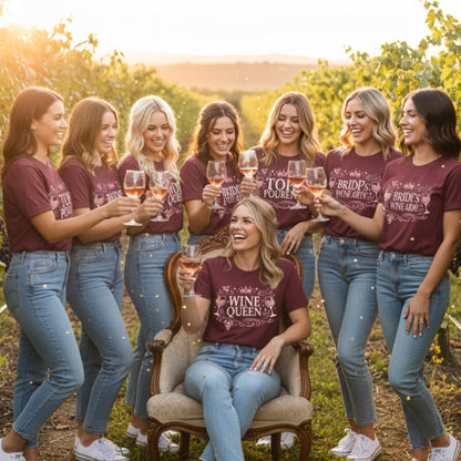 Group of hen party women in matching maroon t-shirts in a vineyard setting.